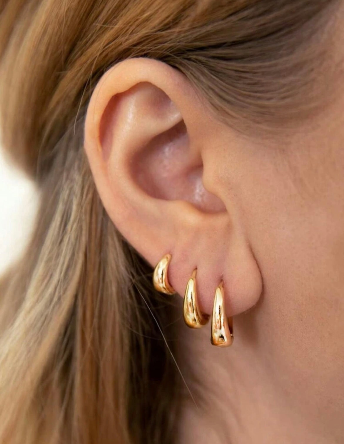 Set of three golden earrings